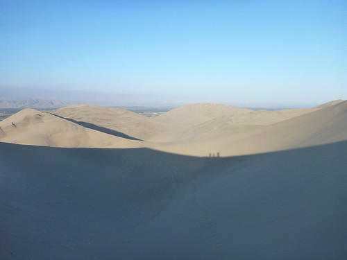 Our shadows against the next dune